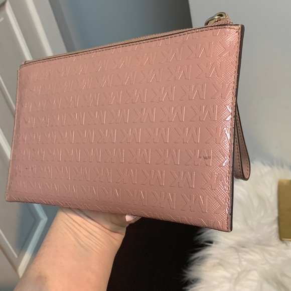 Authentic soft pink patent leather large wristlet clutch by Michael Kors